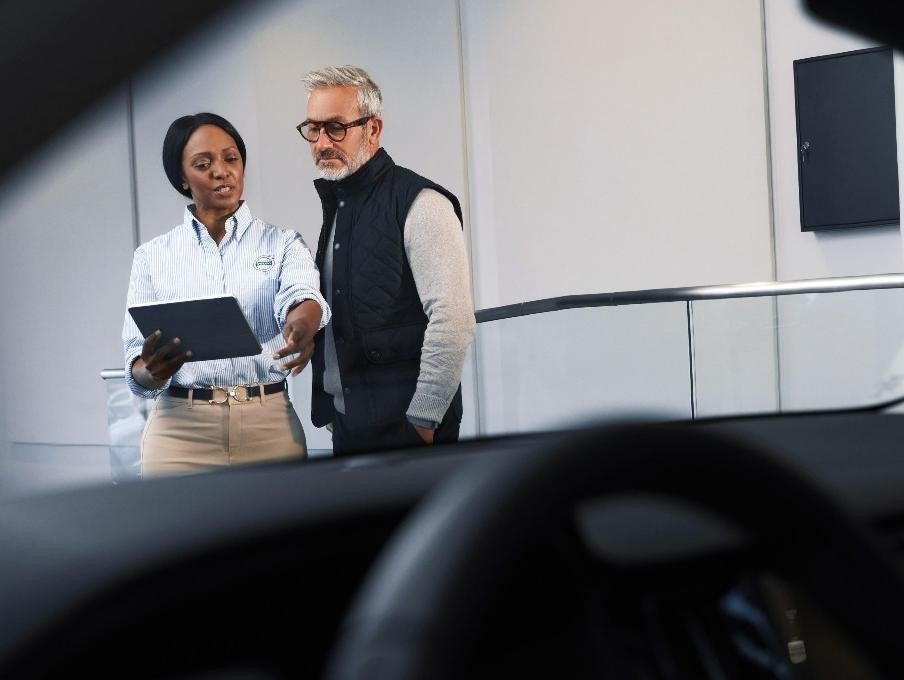 salesperson with customers Bomnin Chevrolet Buick GMC Nanuet in Nanuet NY