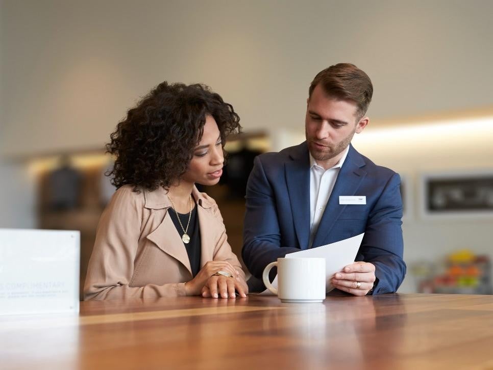 woman with salesman calculating Bomnin Chevrolet Nanuet in Nanuet NY